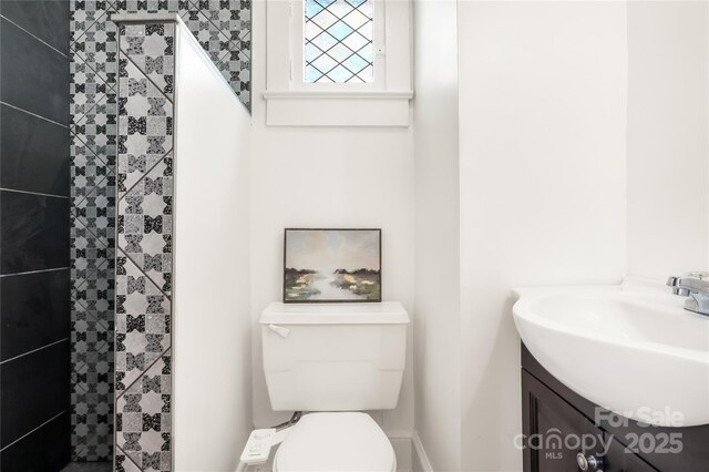 17 Springdale Ave, Asheville, NC 28803 - bathroom featuring vanity, toilet, and a tile shower