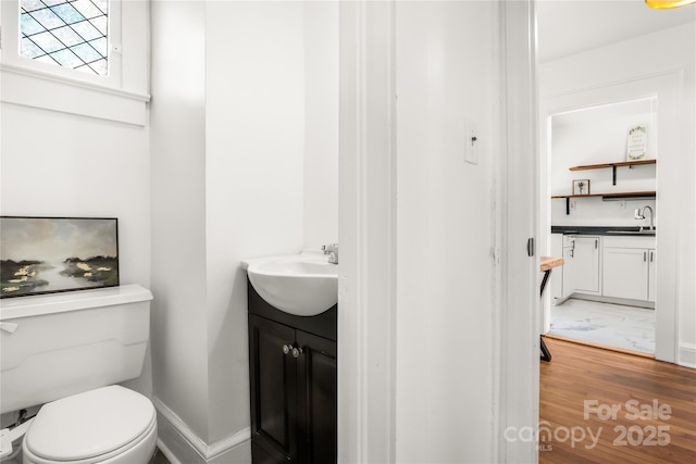 17 Springdale Ave, Asheville, NC 28803 - bathroom with vanity, wood finished floors, toilet, and baseboards