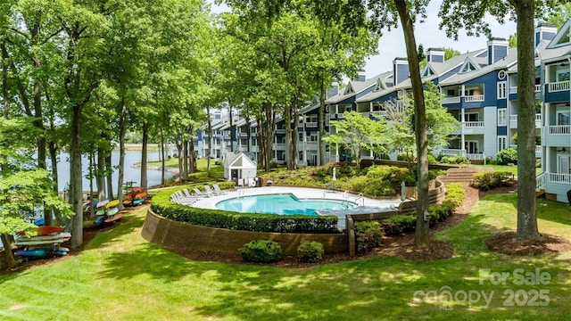 302 NW Dr, Davidson, NC 28036 - view of swimming pool featuring a water view and a lawn