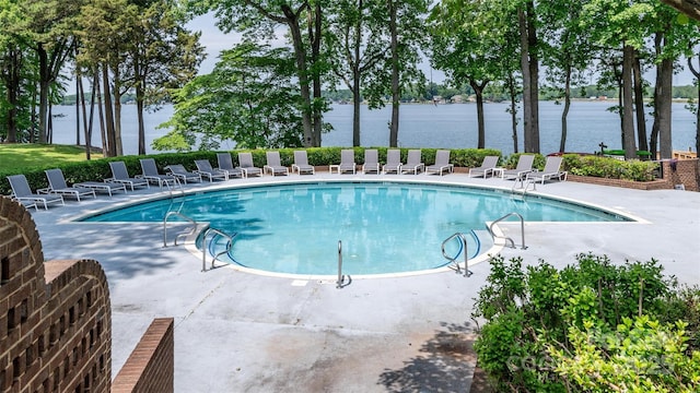 302 NW Dr, Davidson, NC 28036 - community pool featuring a water view and a patio