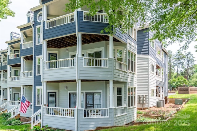 302 NW Dr, Davidson, NC 28036 - view of home's exterior featuring a balcony and a central air condition unit