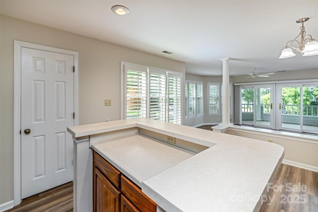 302 NW Dr, Davidson, NC 28036 - kitchen featuring decorative columns, healthy amount of natural light, dark wood finished floors, and recessed lighting
