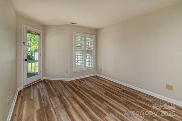 302 NW Dr, Davidson, NC 28036 - spare room with wood finished floors and baseboards