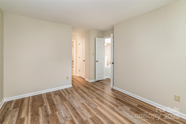 302 NW Dr, Davidson, NC 28036 - unfurnished room featuring wood finished floors and baseboards