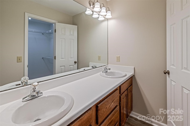 302 NW Dr, Davidson, NC 28036 - full bathroom featuring double vanity and a walk in closet