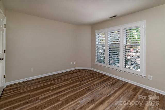 302 NW Dr, Davidson, NC 28036 - unfurnished room featuring dark wood-style flooring and baseboards