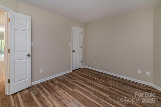 302 NW Dr, Davidson, NC 28036 - unfurnished room with wood finished floors and baseboards
