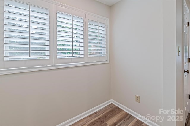 302 NW Dr, Davidson, NC 28036 - unfurnished room featuring wood finished floors and plenty of natural light