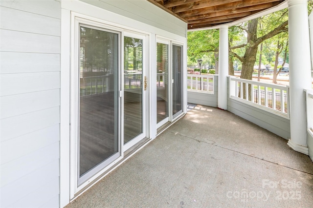 302 NW Dr, Davidson, NC 28036 - unfurnished sunroom featuring healthy amount of natural light and carpet