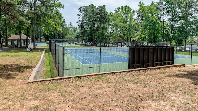 302 NW Dr, Davidson, NC 28036 - view of tennis court featuring view of wooded area