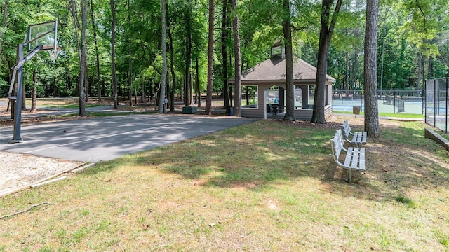 302 NW Dr, Davidson, NC 28036 - view of yard with community basketball court, a tennis court, and driveway