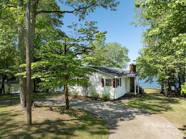 17835 Terryglass Ln, Charlotte, NC 28278 - view of front of house with a chimney, concrete driveway, and a front yard