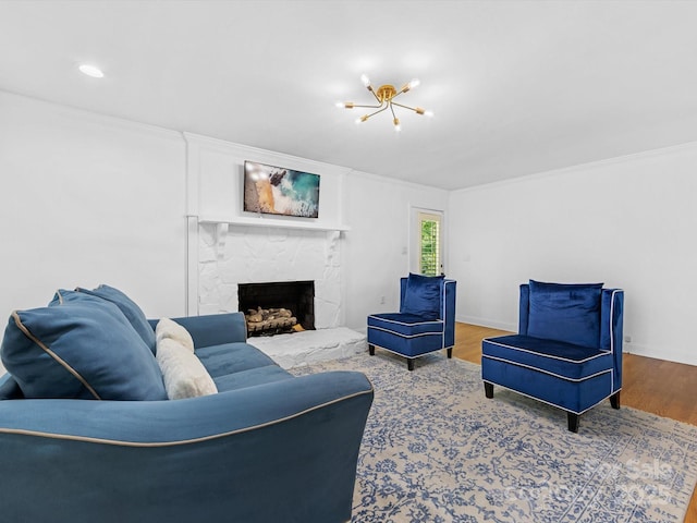 17835 Terryglass Ln, Charlotte, NC 28278 - living room featuring wood finished floors, a chandelier, crown molding, a stone fireplace, and baseboards