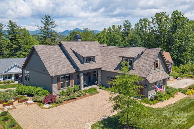 5 Buckhorn Gap Rd, Biltmore Lake, NC 28715 - view of front of property featuring decorative driveway, a chimney, roof with shingles, and a mountain view