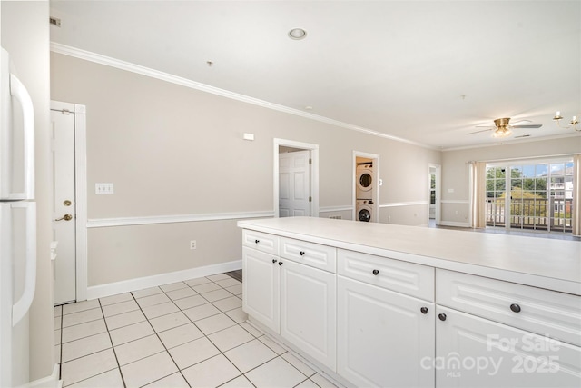 8969 Meadow Vista Rd, Charlotte, NC 28213 - kitchen with stacked washer / drying machine, ornamental molding, white cabinetry, ceiling fan, and light countertops