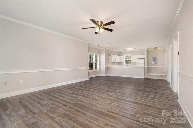 8969 Meadow Vista Rd, Charlotte, NC 28213 - unfurnished living room with ceiling fan, dark wood-type flooring, a chandelier, crown molding, and baseboards