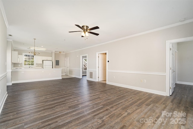 8969 Meadow Vista Rd, Charlotte, NC 28213 - unfurnished living room featuring ceiling fan, ornamental molding, dark wood finished floors, baseboards, and a chandelier