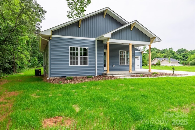 160 Wayne Gobble Rd, Linwood, NC 27299 - view of front facade with a porch, a front yard, and central air condition unit