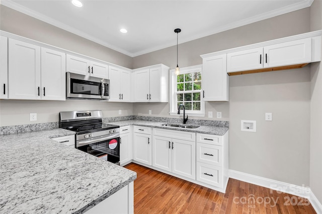 160 Wayne Gobble Rd, Linwood, NC 27299 - kitchen featuring appliances with stainless steel finishes, a sink, crown molding, white cabinets, and recessed lighting