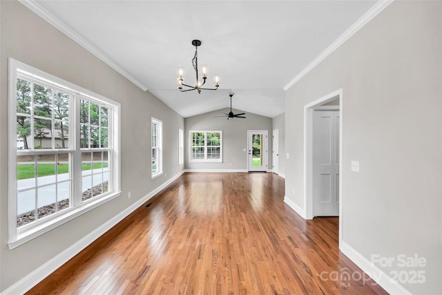160 Wayne Gobble Rd, Linwood, NC 27299 - spare room with a chandelier, light wood finished floors, baseboards, vaulted ceiling, and crown molding