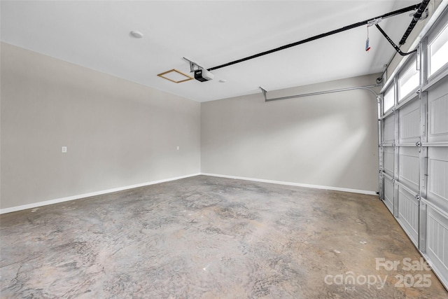 160 Wayne Gobble Rd, Linwood, NC 27299 - garage with a garage door opener and baseboards