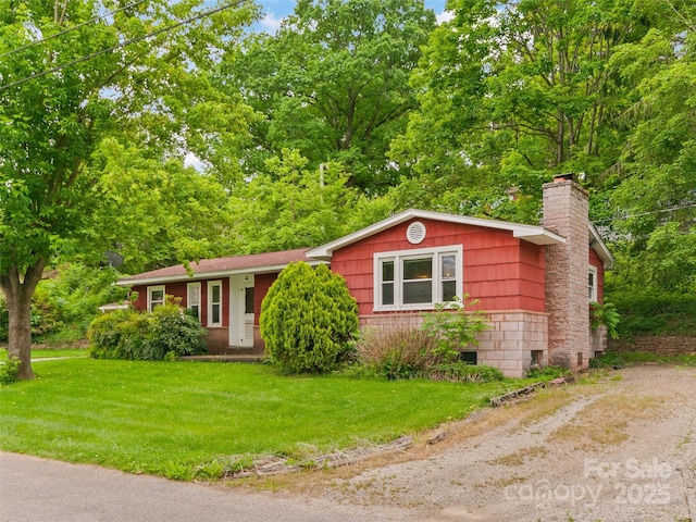 49 Caring Place Loop, Clyde, NC 28721 - ranch-style house featuring a chimney, a front lawn, and driveway