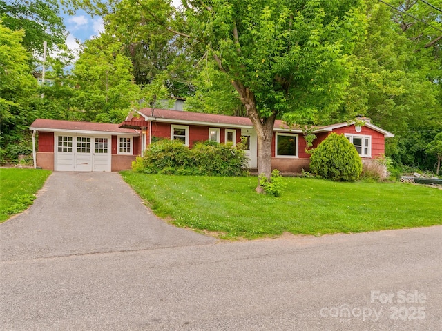 49 Caring Place Loop, Clyde, NC 28721 - ranch-style home featuring an attached garage, driveway, and a front lawn