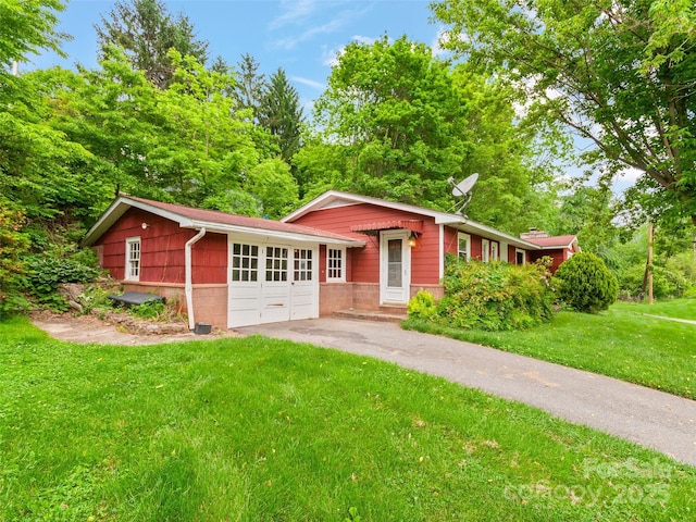 49 Caring Place Loop, Clyde, NC 28721 - ranch-style home featuring a front yard, driveway, and a garage