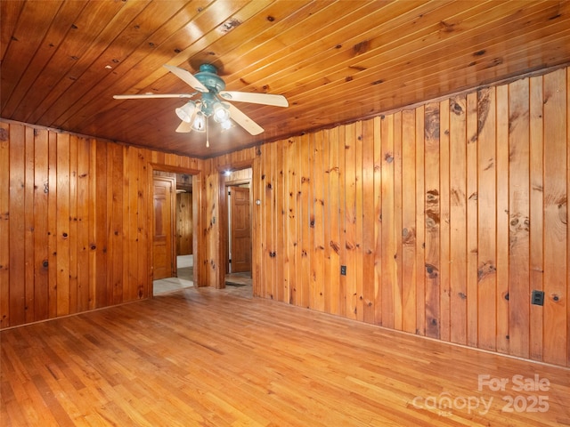 49 Caring Place Loop, Clyde, NC 28721 - spare room with wood ceiling, a ceiling fan, wood walls, and wood finished floors