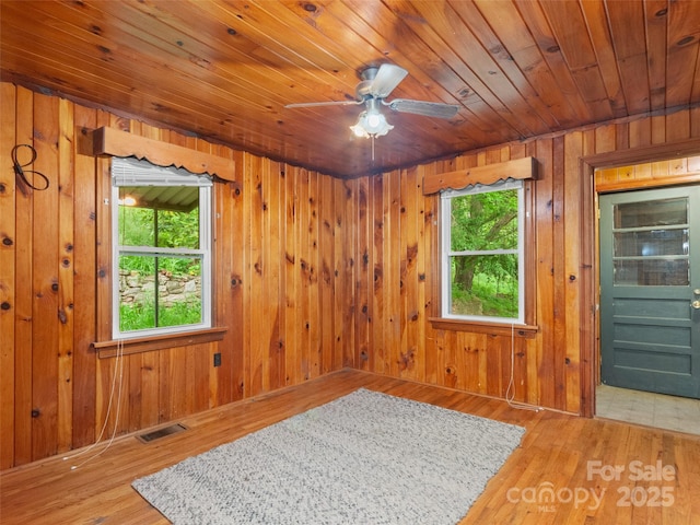 49 Caring Place Loop, Clyde, NC 28721 - empty room with wood walls, wooden ceiling, wood finished floors, and a ceiling fan