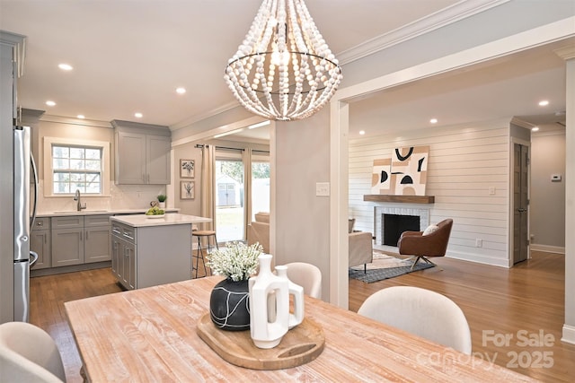 532 Scaleybark Rd, Charlotte, NC 28209 - dining room with crown molding, plenty of natural light, dark wood-style floors, recessed lighting, and a chandelier