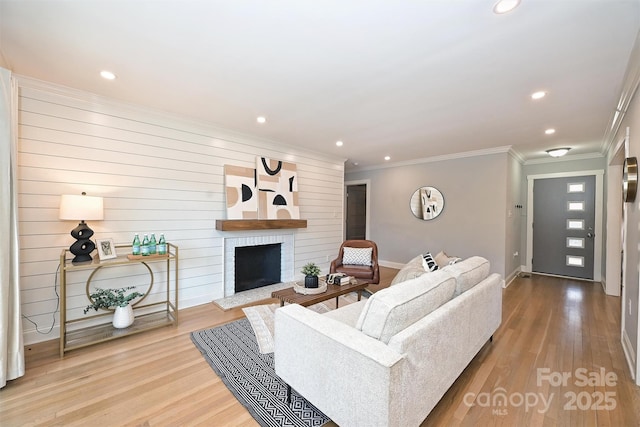 532 Scaleybark Rd, Charlotte, NC 28209 - living area with baseboards, recessed lighting, a brick fireplace, wood finished floors, and crown molding