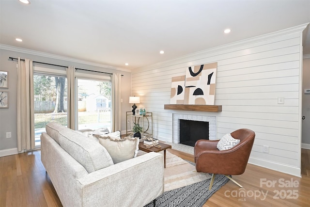 532 Scaleybark Rd, Charlotte, NC 28209 - living area with crown molding, baseboards, wood finished floors, a brick fireplace, and recessed lighting