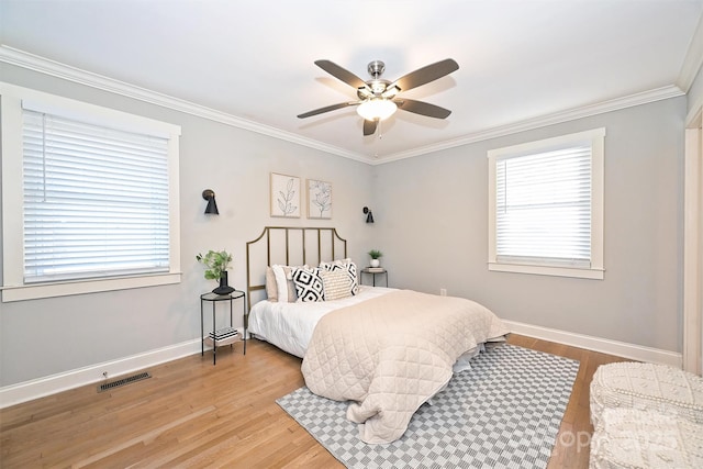 532 Scaleybark Rd, Charlotte, NC 28209 - bedroom featuring baseboards, wood finished floors, crown molding, multiple windows, and ceiling fan