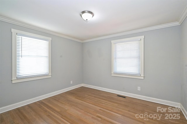 532 Scaleybark Rd, Charlotte, NC 28209 - empty room with crown molding, baseboards, and wood finished floors