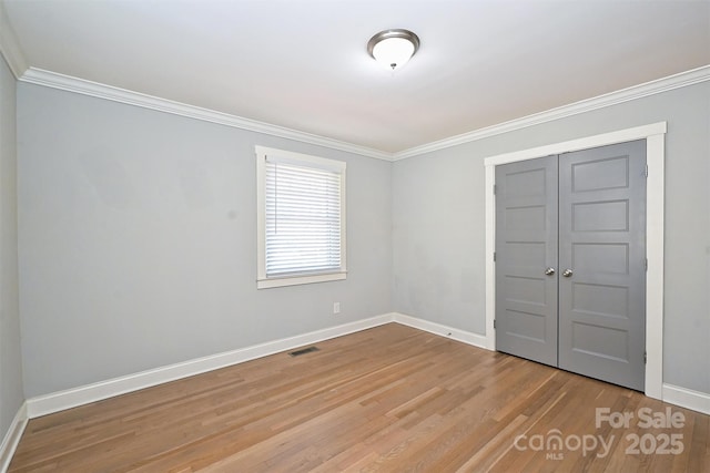 532 Scaleybark Rd, Charlotte, NC 28209 - spare room with baseboards, ornamental molding, and wood finished floors