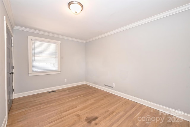532 Scaleybark Rd, Charlotte, NC 28209 - unfurnished room with baseboards, ornamental molding, and light wood finished floors