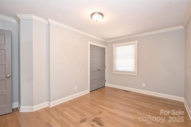 532 Scaleybark Rd, Charlotte, NC 28209 - unfurnished bedroom with baseboards, light wood-type flooring, and ornamental molding
