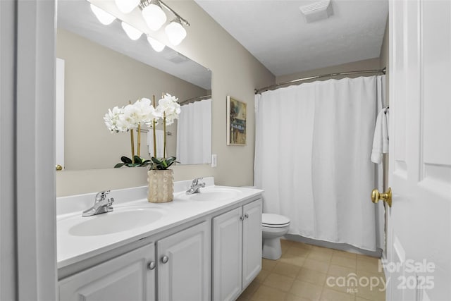 205 Davis Dr, Morganton, NC 28655 - full bathroom featuring double vanity, toilet, and a shower with shower curtain