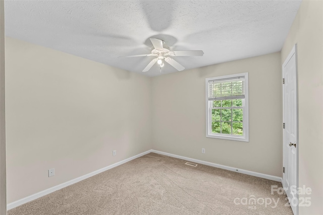 205 Davis Dr, Morganton, NC 28655 - empty room featuring carpet flooring, baseboards, a ceiling fan, and a textured ceiling