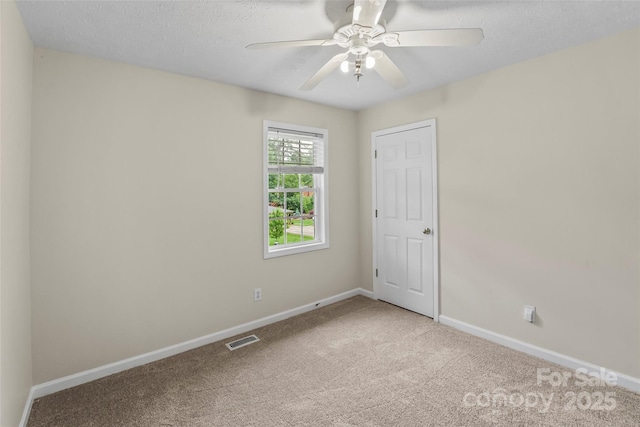 205 Davis Dr, Morganton, NC 28655 - empty room featuring carpet flooring, baseboards, a ceiling fan, and a textured ceiling