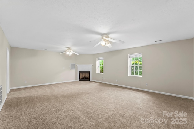 205 Davis Dr, Morganton, NC 28655 - unfurnished living room featuring ceiling fan, carpet flooring, a fireplace, and baseboards
