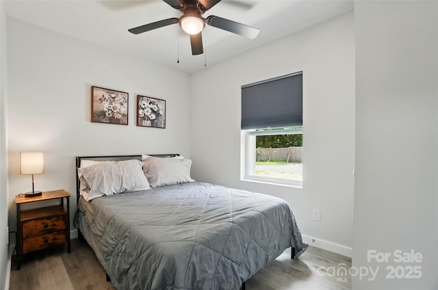 13821 David St, Huntersville, NC 28078 - bedroom featuring wood finished floors, a ceiling fan, and baseboards