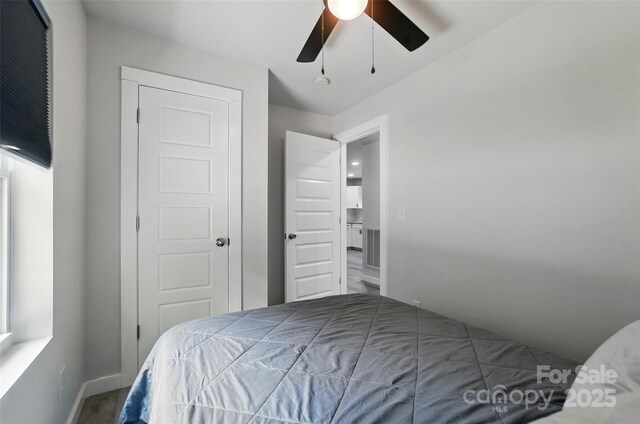 13821 David St, Huntersville, NC 28078 - bedroom with baseboards and ceiling fan