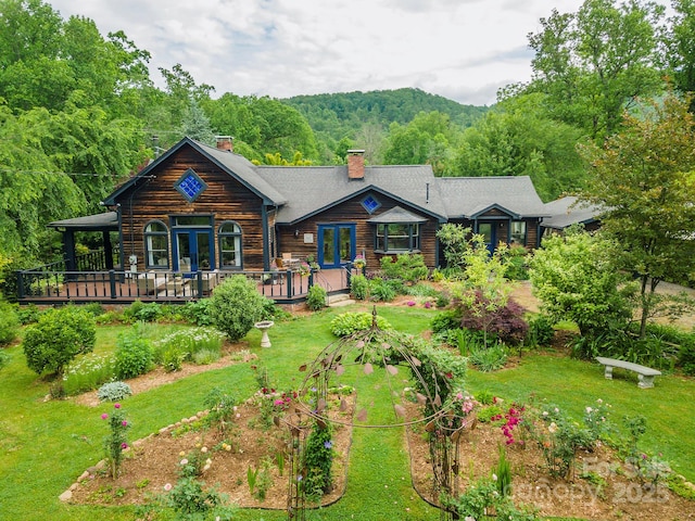 528 Padgettown Rd, Black Mountain, NC 28711 - back of house featuring a chimney, french doors, a yard, and a wooded view