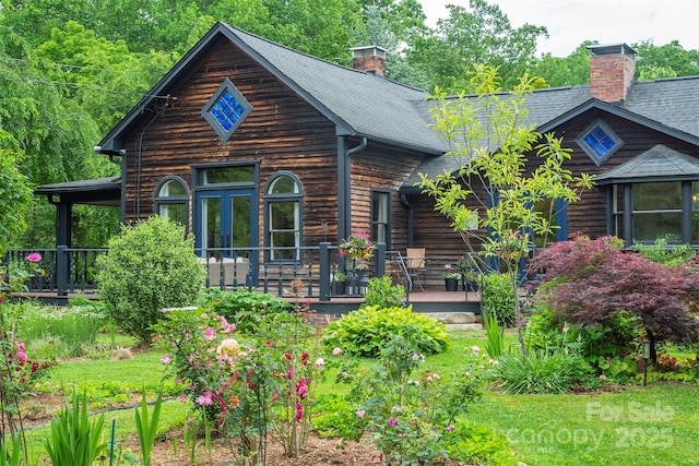 528 Padgettown Rd, Black Mountain, NC 28711 - view of front of home featuring a chimney, covered porch, and roof with shingles