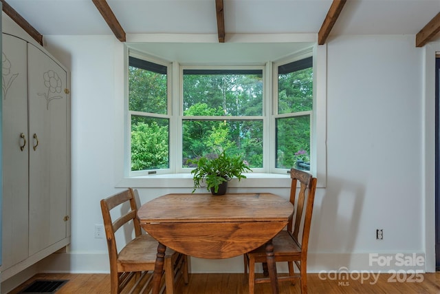 528 Padgettown Rd, Black Mountain, NC 28711 - dining room with beamed ceiling, wood finished floors, and baseboards
