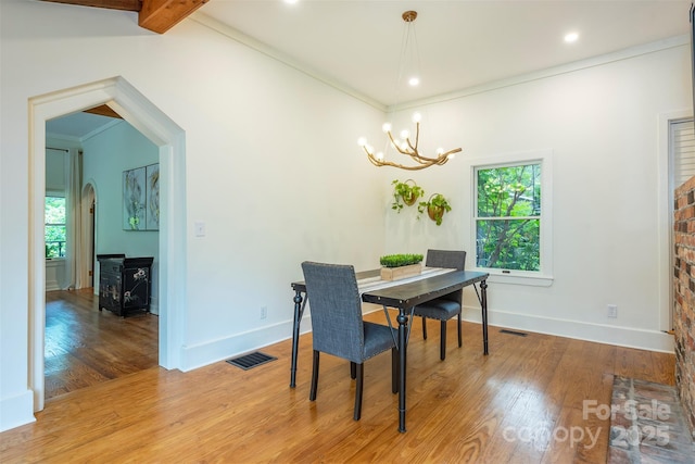 528 Padgettown Rd, Black Mountain, NC 28711 - dining space featuring a chandelier, wood finished floors, arched walkways, baseboards, and recessed lighting