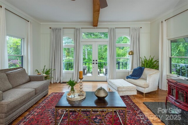 528 Padgettown Rd, Black Mountain, NC 28711 - living area with plenty of natural light, a ceiling fan, french doors, beam ceiling, and wood finished floors