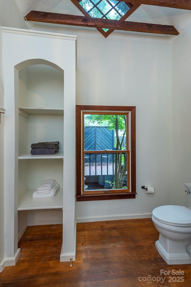 528 Padgettown Rd, Black Mountain, NC 28711 - bathroom featuring toilet, wood finished floors, built in features, baseboards, and vaulted ceiling